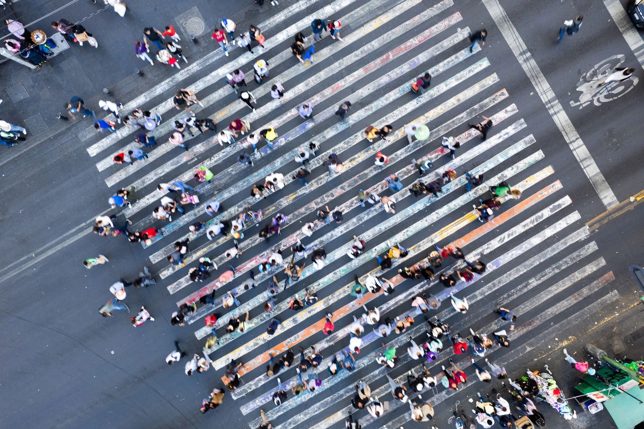A Bustling City Intersection Captured From Above With Pedestrians Crossing in Multiple Directions