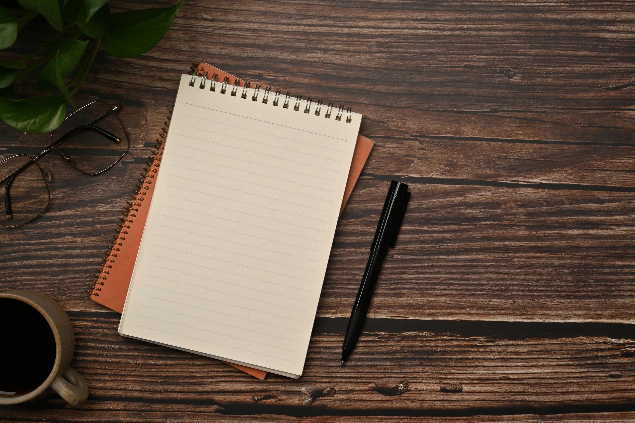 Notebook and pen representing notes and citations