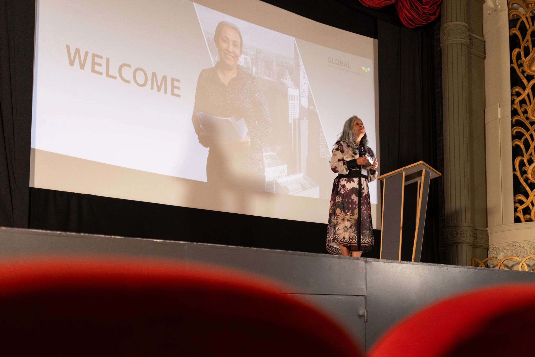 Speaker delivering a keynote on stage